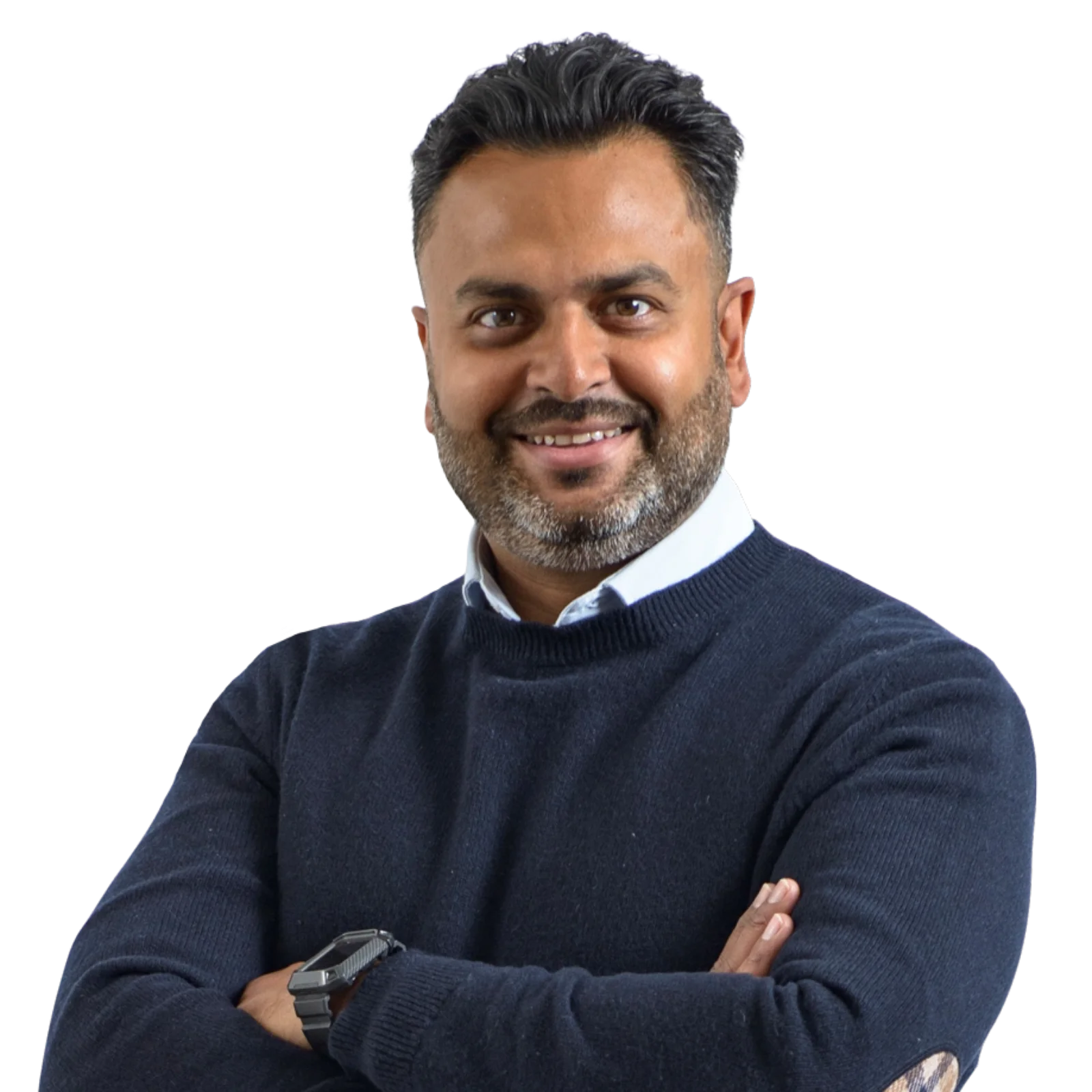 Portrait of Alpesh Tailor in a navy sweater, smiling.