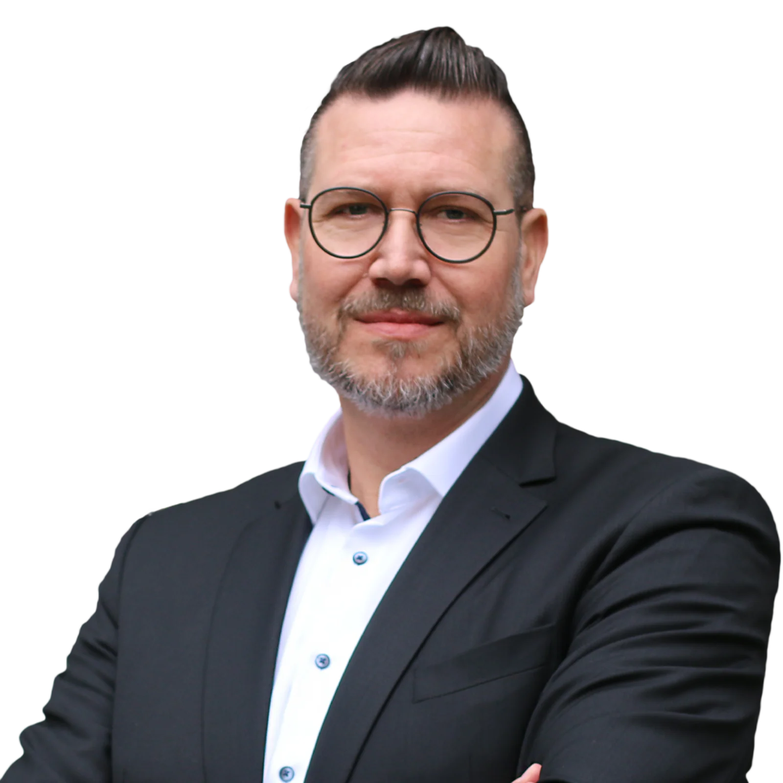 Portrait of Andreas Herzog wearing glasses, a dark blazer, and a white shirt, smiling confidently with arms crossed.