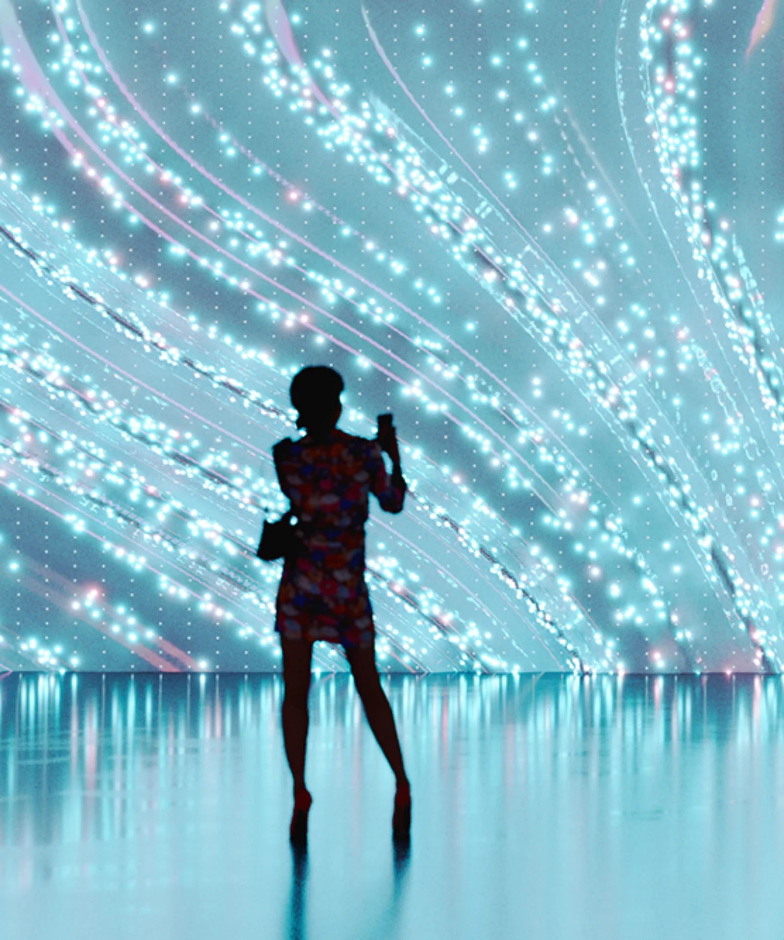 Silhouette of a person standing before a large, flowing digital light display, representing the interaction between humans and advanced digital technology.