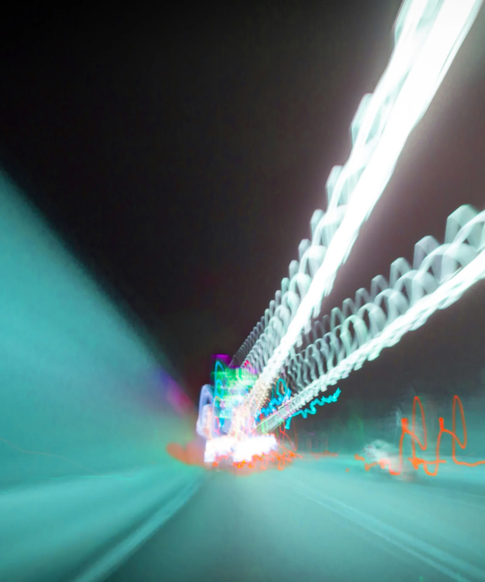 Abstract image depicting light trails in a tunnel, symbolising speed and connectivity