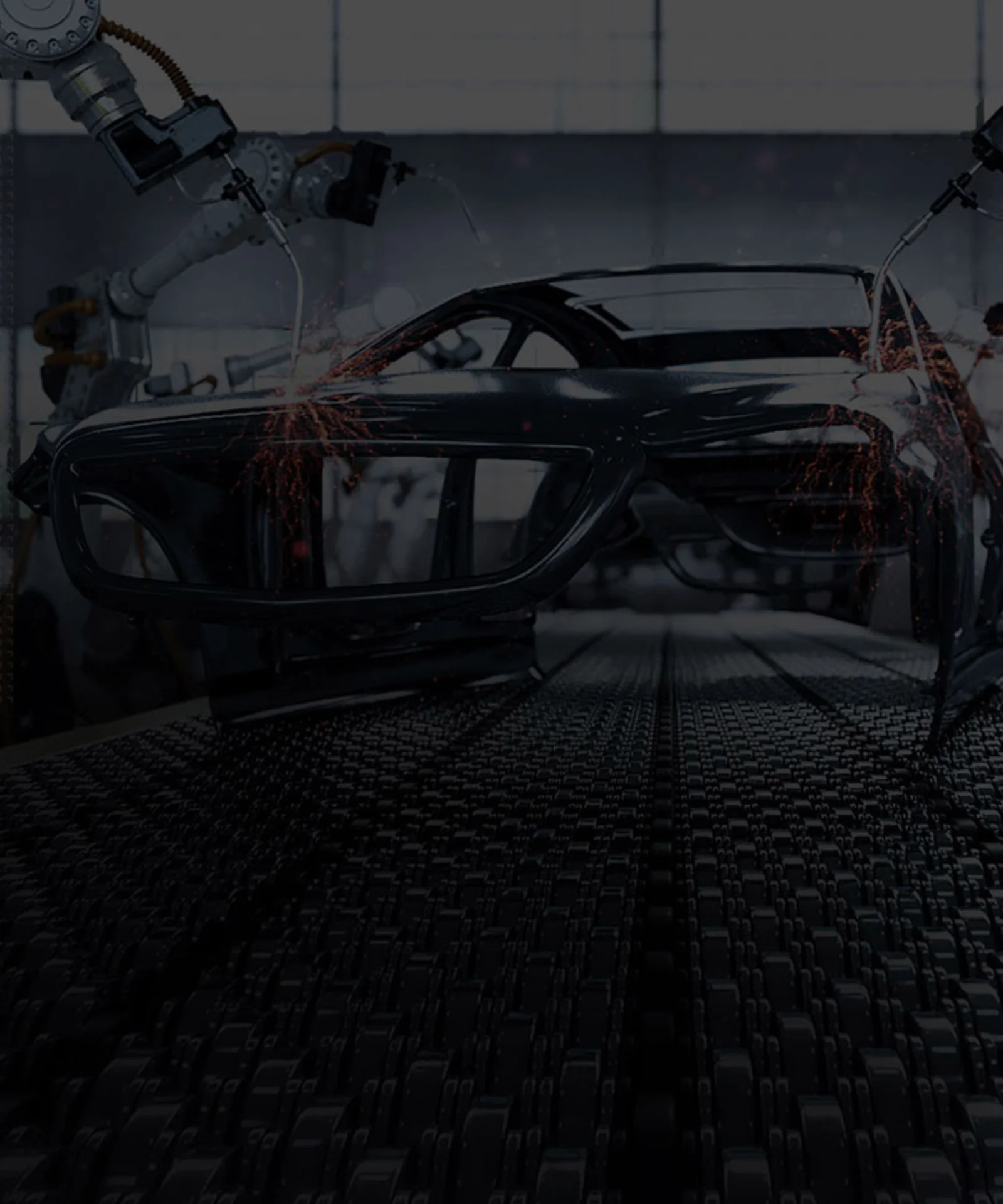 Robotic arms welding and assembling a car frame in a high-tech automotive manufacturing factory.