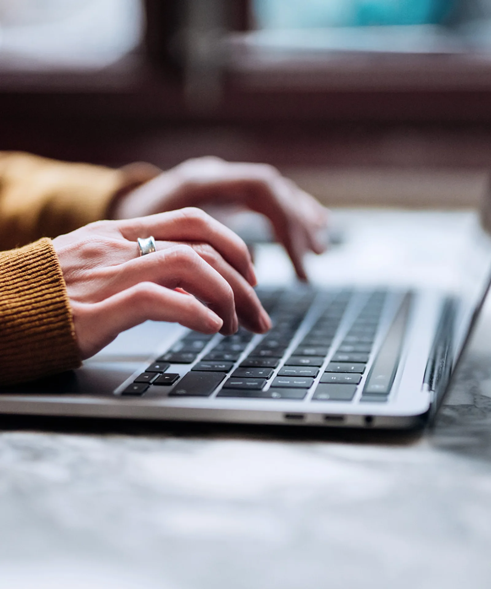 A person typing on a laptop keyboard, symbolising the engagement and interaction with ChatGPT, representing modern AI-driven communication and assistance.