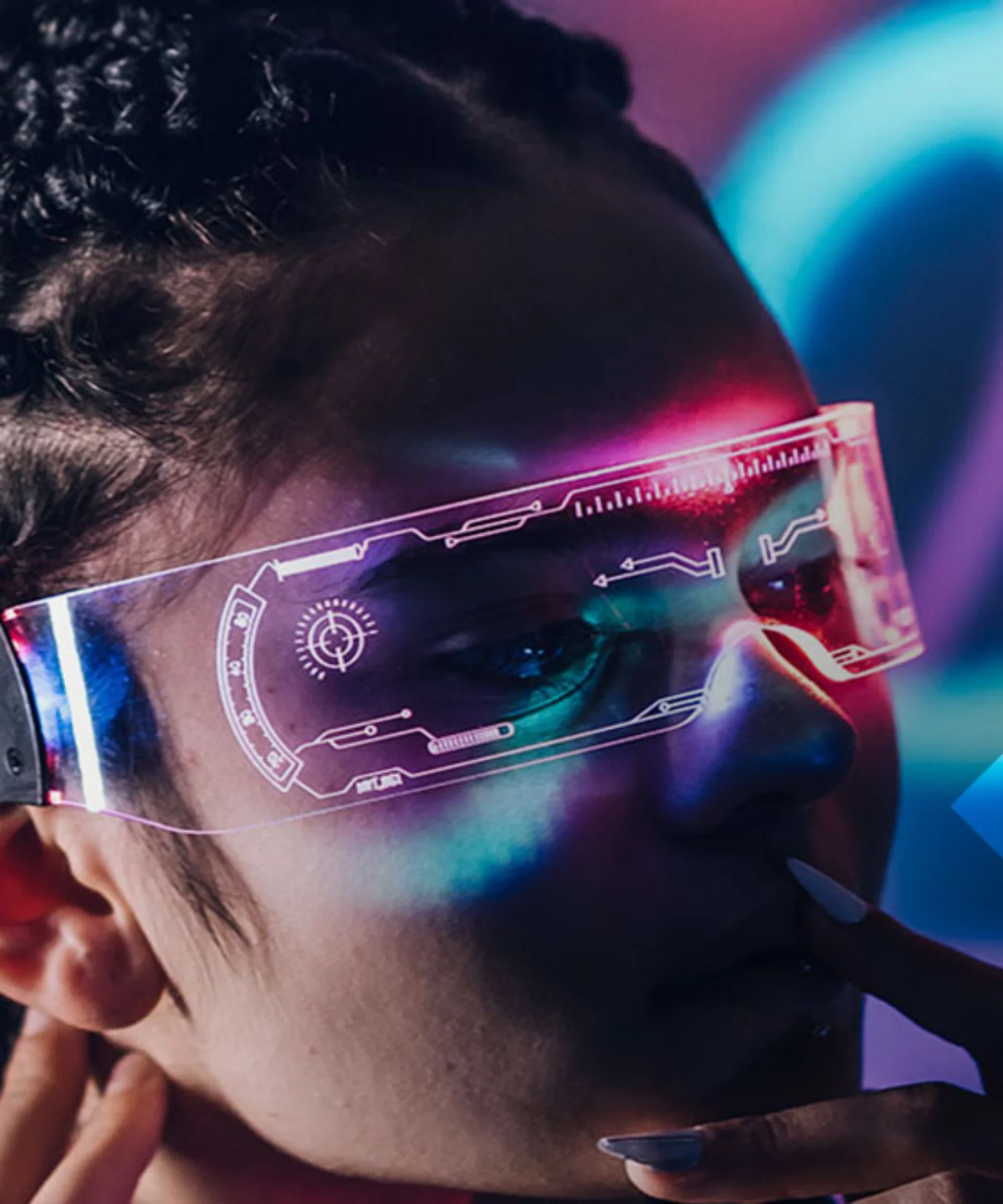 Close-up of a person wearing augmented reality glasses, immersed in a colorful, futuristic digital environment.