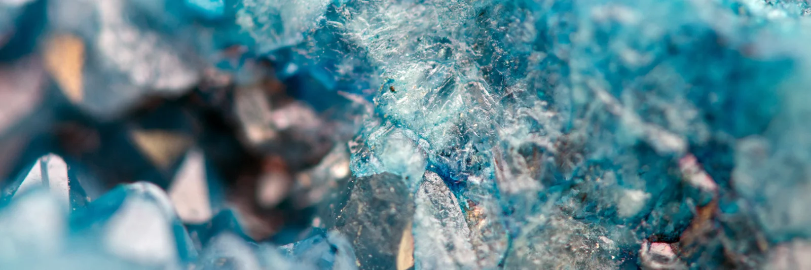 Close-up of intricate blue crystal formations, symbolising the precision and security of database management and policy as code in the Azure Cloud.