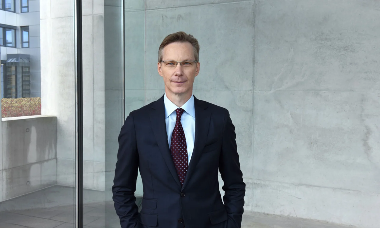 Jochen Rütz, Member of the Administrative Board, standing confidently in a modern building