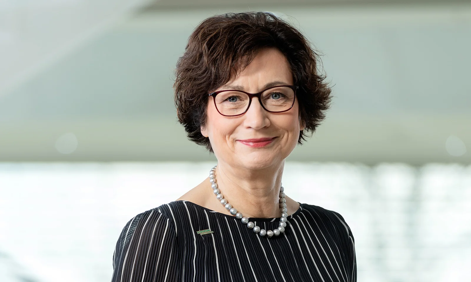 Portrait of Dr. Annette Beller, Member of the Administrative Board, in a professional setting