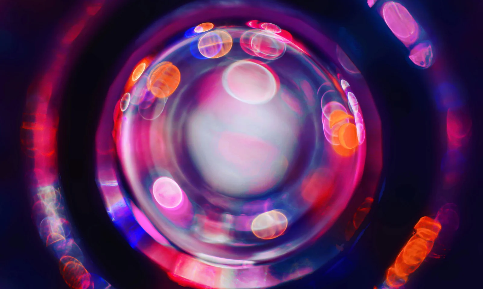 An abstract image featuring vibrant circles of light, representing AI-driven visual inspection technology in manufacturing.