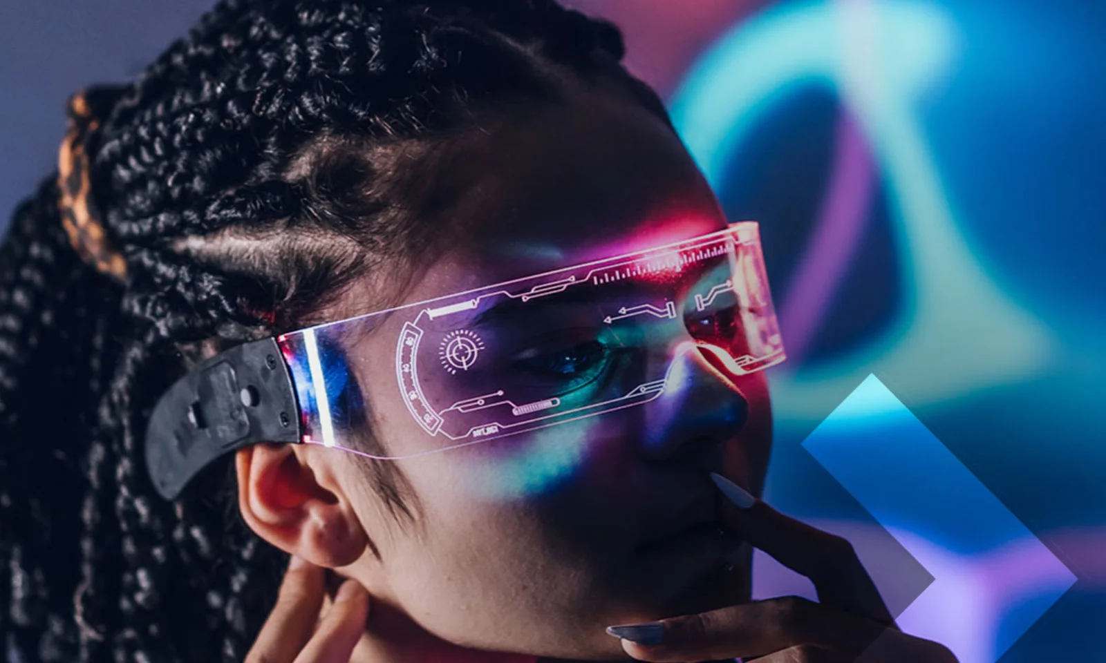 Close-up of a person wearing augmented reality glasses, immersed in a colorful, futuristic digital environment.